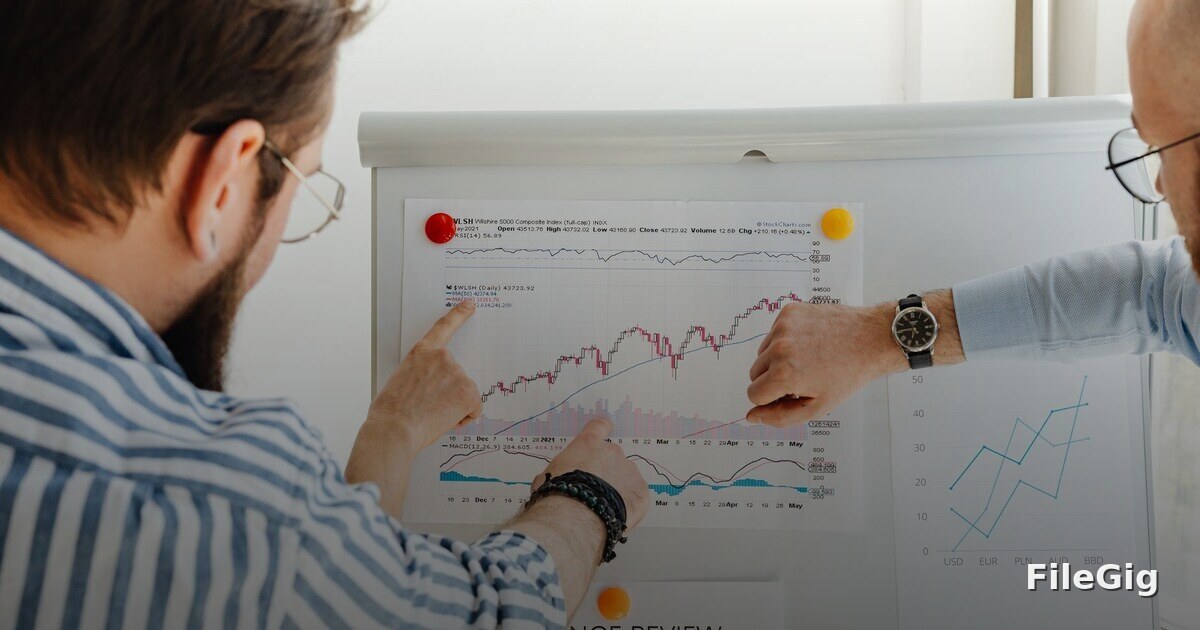 A team collaborating around growth charts that illustrate recurring referral revenue